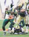 CP
John Woods / the canadian press files
Wily Eskimos quarterback Mike Reilly eludes Bombers would-be tacklers for the nth time Thursday night.