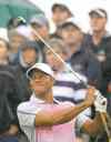 CP
Peter Morrison / the associated pressTiger Woods whacks a tee shot on 14. By that point he was out of contention and on his way to a 73.