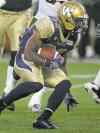 Winnipeg Blue Bomber #32 Nic Grigsby looks for room in the 3rd quarter Thursday evening at Investor's Field. See story.
July 16, 2014 - (Phil Hossack / Winnipeg Free Press)