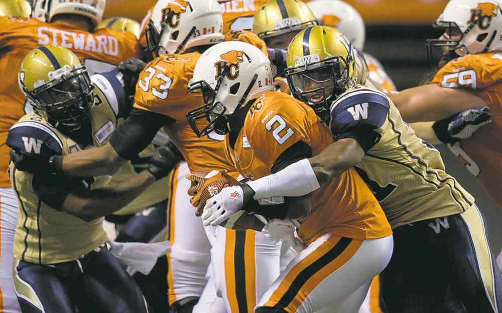 CP
Darryl Dyck / THE CANADIAN PRESS
The Bombers� Maurice Leggett sacks Lions quarterback Kevin Glenn Friday.