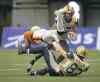 CP
Darryl Dyck / THE CANADIAN PRESS
The B.C. Lions� Dante Marsh (left) collides with the Winnipeg Blue Bombers� Rory Kohlert (bottom) as Nick Moore carries the ball during the first half in Vancouver Friday.
