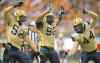 The Canadian Press
The Blue's Louie Richardson (from left), Bryant Turner Jr. and Zach Anderson celebrate a sack Friday.