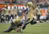 CP
Darryl Dyck / THE CANADIAN PRESS
The Bombers� Lirim Hajrullahu (right) kicks a field goal with quarterback Brian Brohm holding in Friday�s first half. Hajrullahu�s performance of several jobs is impressive stuff for a rookie.