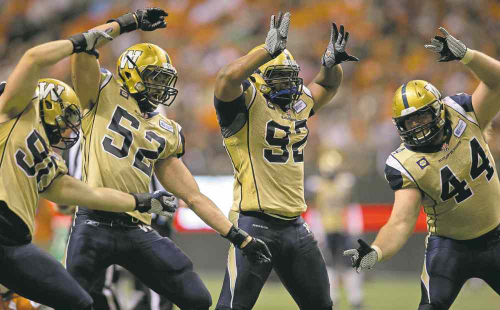 Darryl Dyck / the canadian press files
Winnipeg Blue Bombers defensive linemen (from left) Greg Peach, Louie Richardson, Bryant Turner and Zach Anderson are digging what the coaches are preaching.