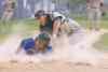 Sarah Taylor / Winnipeg Free Press St. Boniface�s Zach Riet slides home base into the tag of Elmwood catcher Drew Allen Thursday night. Riet was out on the play.