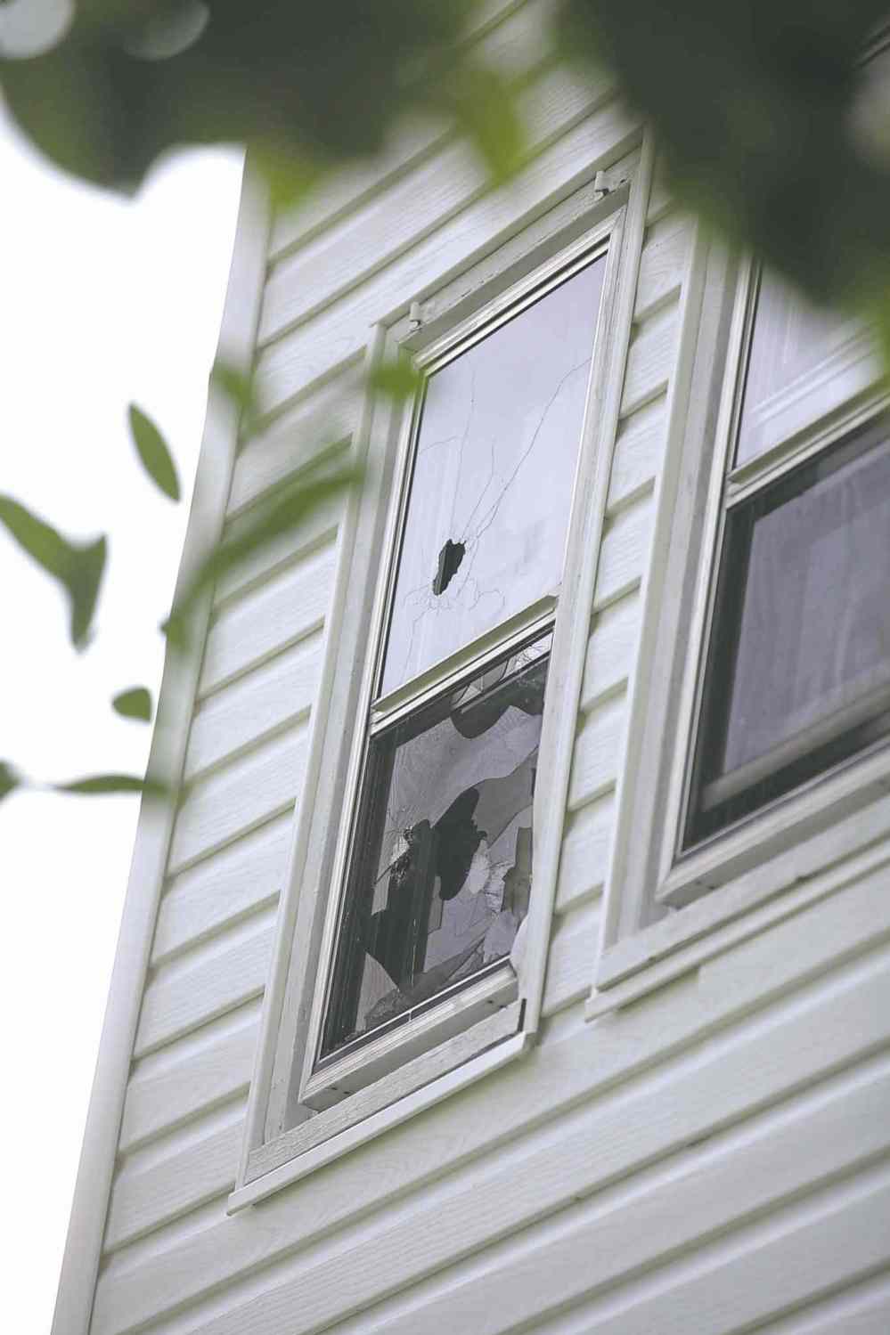 PHOTOS BY ruth bonneville / winnipeg free press
The house at 512 Stella Ave., the home in which Andrew Baryluk (inset) lived before he died following a 17-hour standoff with Winnipeg police. Bullet holes are visible in an upstairs window.