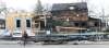 WAYNE GLOWACKI / WINNIPEG FREE PRESS
A cyclist pauses Monday morning to look at the damage from the weekend fire that destroyed a new housing construction site (foreground) and severely damaged two other houses in the Wolseley neighbourhood at the intersection of Westminster Avenue and Maryland Street.
