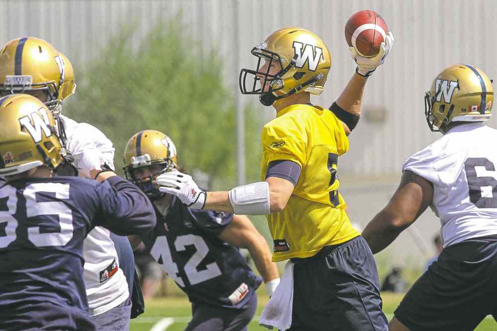 MIKE DEAL / WINNIPEG FREE PRESS
MIKE DEAL / WINNIPEG FREE PRESS
The often unprotected Drew Willy fires a pass during Sunday�s workout. The QB and his Blue and Gold teammates are back in action Tuesday in Toronto.