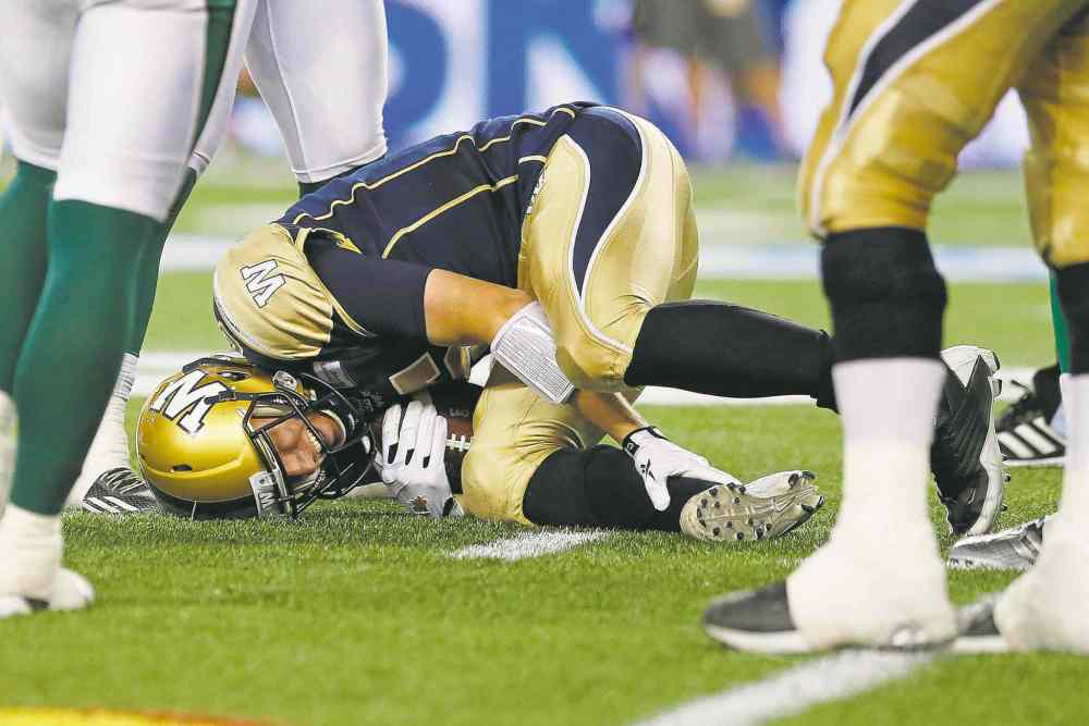 John Woods / The Canadian Press
Bombers quarterback Drew Willy in a pose seen all too often the past two seasons in Winnipeg: a starting quarterback in Blue and Gold writhing in pain on the turf.