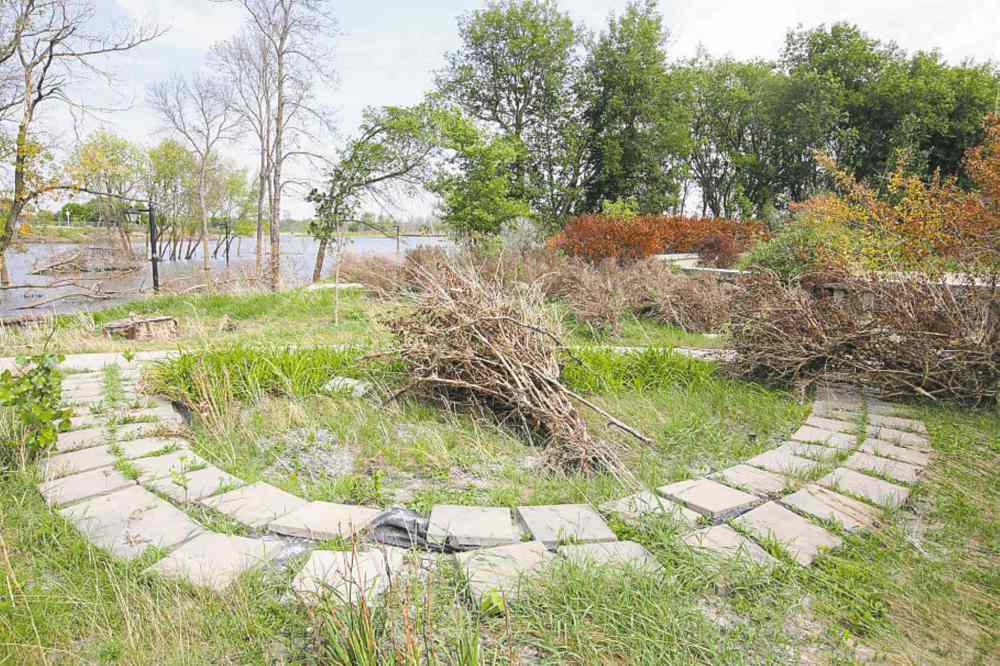 Tim Smith / Brandon Sun
Eleanor Kidd Park is littered with dead wood left by floodwaters littering some of the pathways and gardens. The park has remained closed since the spring of 2011.