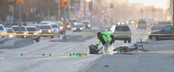 WAYNE GLOWACKI / WINNIPEG FREE PRESSWinnipeg police collect evidence on Nairn Avenue near Chester Street Tuesday morning after a cyclist was struck by a vehicle.