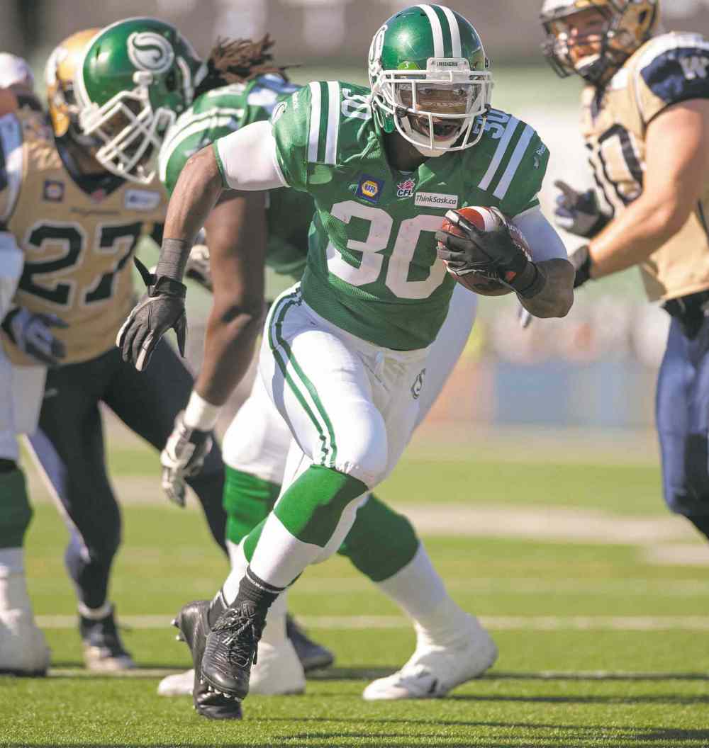 CP
liam richards / the Canadian press files
Roughriders running back Will Ford darts in for a touchdown against his old teammates.
