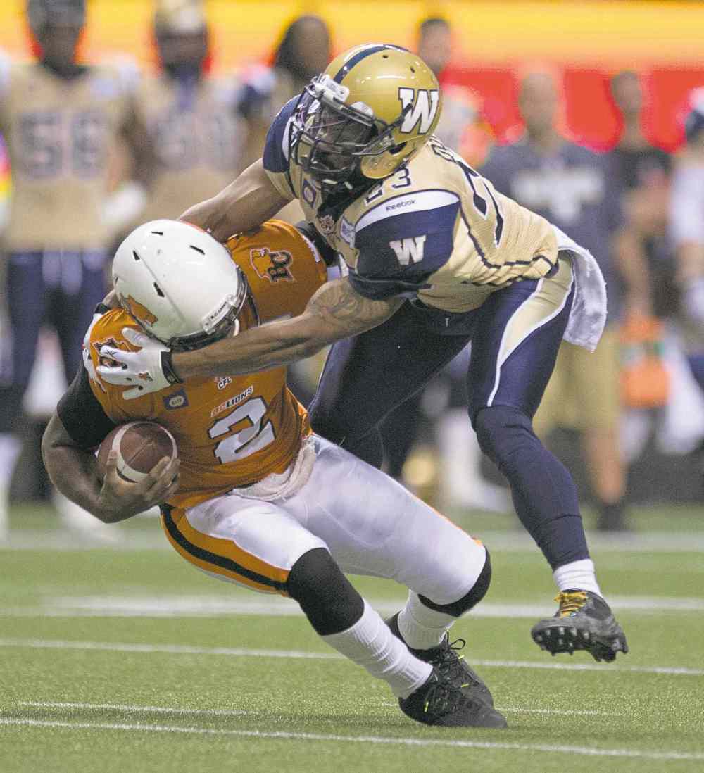 CP
Jonathan Hayward / the canadian press
Winnipeg defender Desia Dunn sacks B.C. quarterback Kevin Glenn during first-half action at BC Place Stadium in Vancouver Saturday.