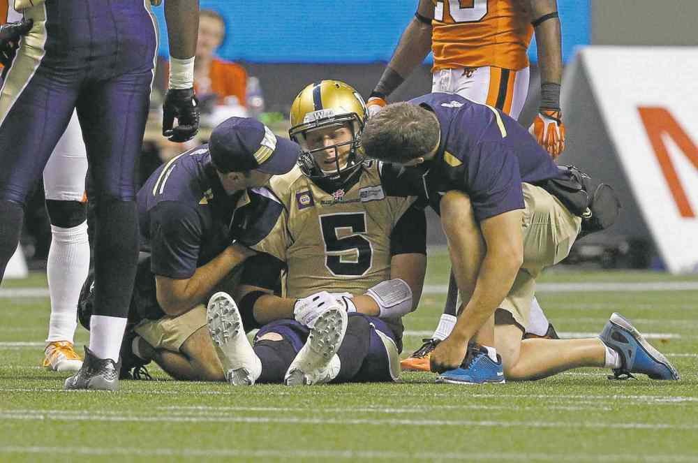 Reuters
Winnipeg Blue Bombers' Drew Willy (5) is checked by medical staff after getting injured while playing against the BC Lions during the second half of their CFL football game in Vancouver Saturday.