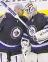 John Woods / The Canadian Press Files
Michael Hutchinson (right) celebrates his first NHL win with Ondrej Pavelec, a shootout win over the Boston Bruins in April.
