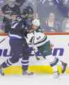 John Woods / WINNIPEG FREE PRESS
Adam Lowry wasn't afraid to use his 6-5, 201-pound frame to dish out some punishment Monday.
