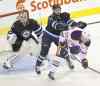 Phil Hossack / Winnipeg Free Press
Winnipeg blue-liner Julian Melchiori hammers Edmonton forward Curtis Hamilton during pre-season action at the MTS Centre Wednesday.