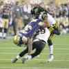 TREVOR HAGAN / WINNIPEG FREE PRESS
Hamilton Tiger-Cats Ed Gainey (29) and Rico Murray hit Winnipeg Blue Bombers' Nic Grigsby during second-half action Saturday night.