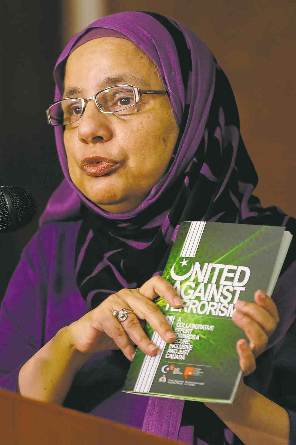 John Woods / The Canadian Press
Shahina Siddiqui, President of the Islamic Social Services Association, holds a copy of United Against Terrorism -- A Collaborative Effort Towards A Secure, Inclusive and Just Canada.