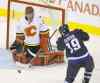 TREVOR HAGAN / WINNIPEG FREE PRESS
 Flames goaltender Jonas Hiller stymies Winnipeg�s Jim Slater during the third period Saturday night at the MTS Centre.