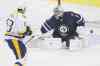 CP
John Woods / the canadian press
Nashville Predators forward Mike Ribeiro deflects a shot from the point past Winnipeg Jets goaltender Ondrej Pavelec in the first period. It stood as the game winner.