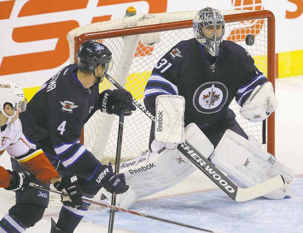 TREVOR HAGAN / WINNIPEG FREE PRESS files
Jets goalie Ondrej Pavelec has surprised some skeptical fans with solid play so far. Having faced the league's best shooters, he has some tips for his team's snipers.