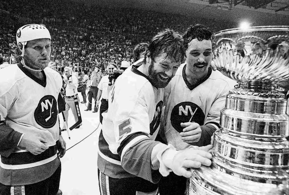 Richard Drew / The Associated Press Files
Denis Potvin (5) caresses the Stanley Cup after the Isles beat Philadelphia in Game 6 to win the 1980 Stanley Cup in the Coliseum.