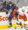 BORIS MINKEVICH / WINNIPEG FREE PRESS 
Winnipeg�s Michael Frolik battles Detroit�s Brian Lashoff for the puck during Thursday�s action.