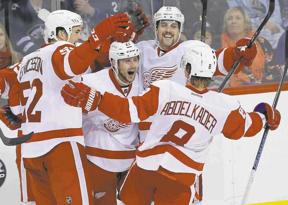 CP
John Woods / the canadian press
Detroit�s Jonathan Ericsson (52), Tomas Tatar (21), Riley Sheahan (15) and Justin Abdelkader celebrate Tatar�s winning goal Thursday night.
