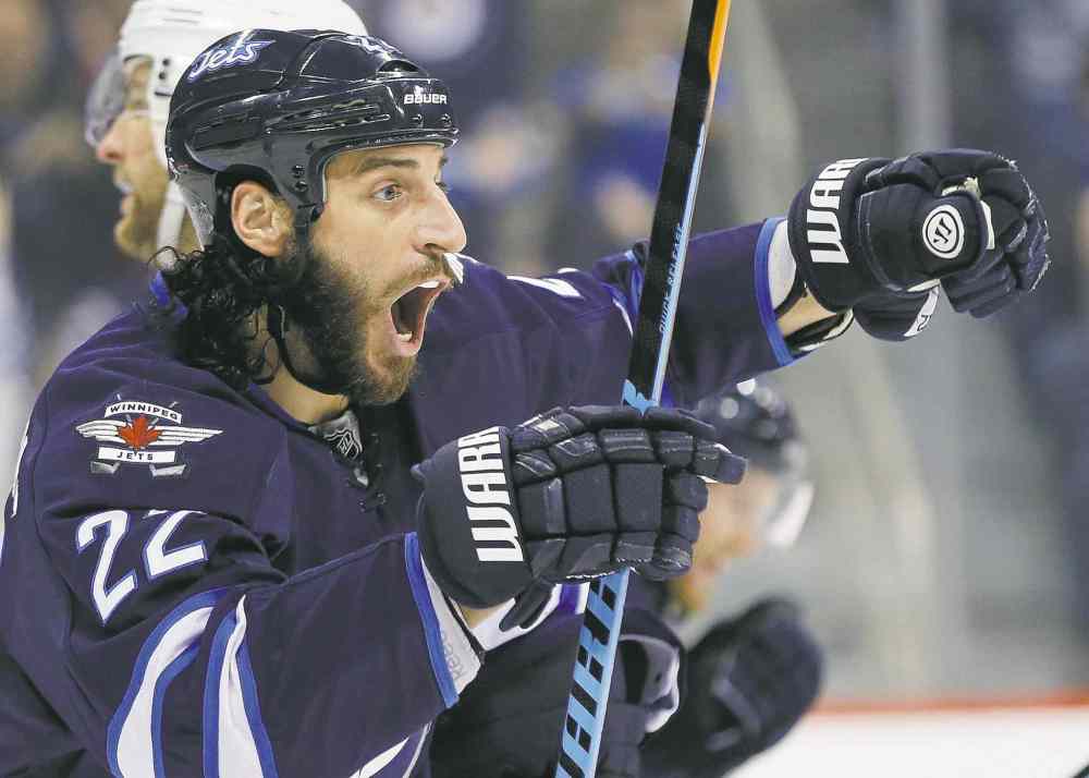 John Woods / The Canadian Press
Winnipeg Jets winger Chris Thorburn celebrates linemate Jim Slater's second-period goal against St. Louis. It was the first goal of the season for the fourth line.