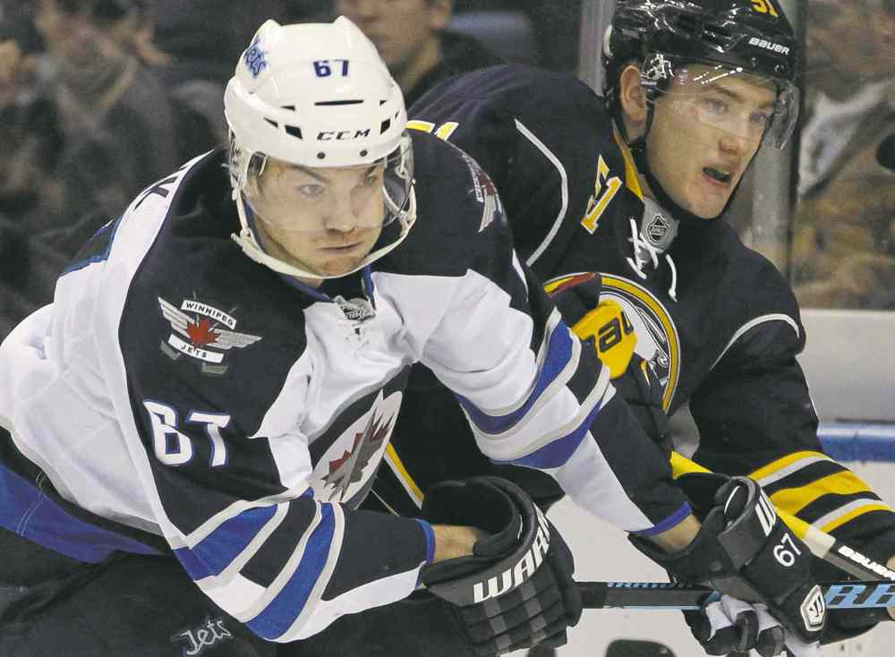 CP
Gary Wiepert / the associated press
Jets right-winger Michael Frolik rubs out Sabres blue-liner Nikita Zadorov during second-period action in Buffalo Wednesday night.