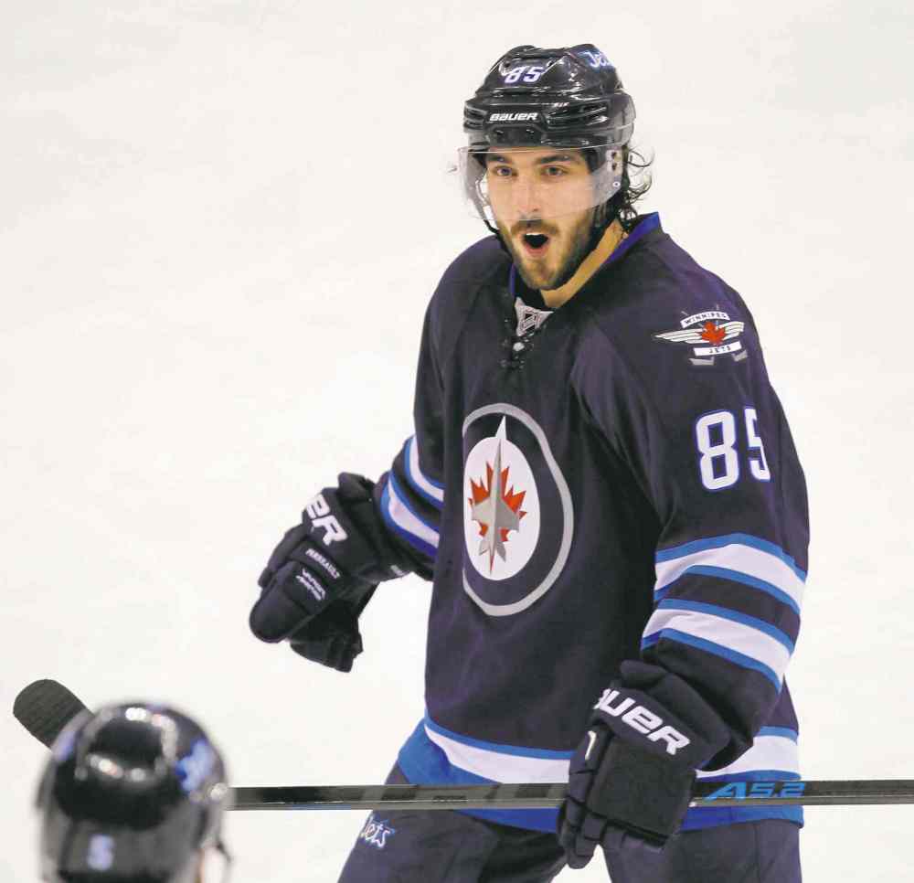 BORIS MINKEVICH / WINNIPEG FREE PRESS files
Veteran forward Mathieu Perreault is expected to draw back into the lineup after missing Wednesday's game in Buffalo with a suspected shoulder injury.
