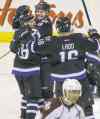 JOE BRYKSA / WINNIPEG FREE PRESS
Bryan Little (left) is congratulated on his hat trick by teammates Jacob Trouba and Andrew Ladd during third-period action Friday.