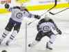 LM OTERO / THE ASSOCIATED PRESS
Winnipeg's Michael Frolik (right) and Blake Wheeler celebrates Frolik's short-handed marker in the second period Tuesday night.