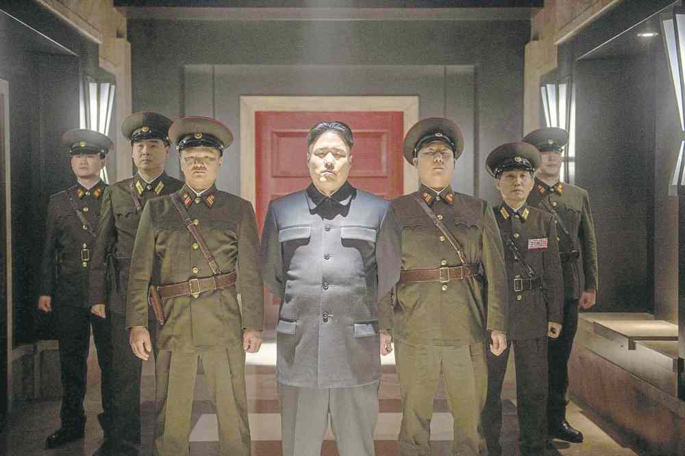 Columbia Pictures
Randall Park, centre, as Kim Jong Un in The Interview. Below, Kim Jong Il as a puppet, in 2004's Team America: World Police.