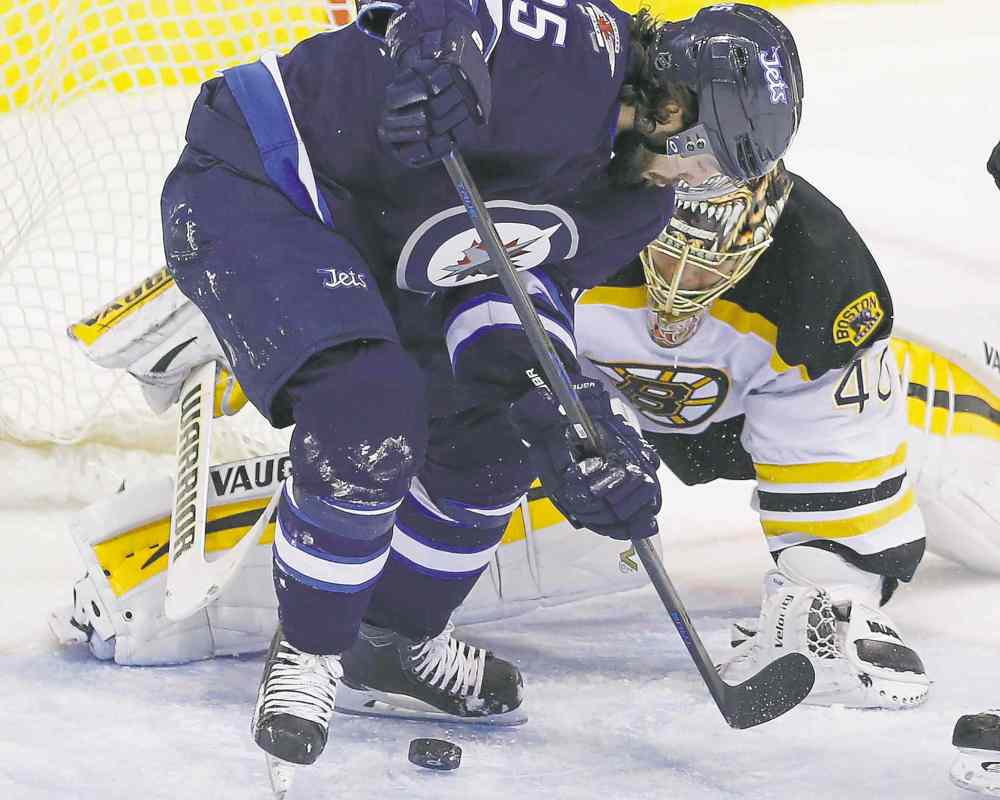 John Woods / The Canadian Press Files
The Winnipeg Jets' Mathieu Perreault (85) attempts the backhander against Boston Bruins goaltender Tuukka Rask (40) during the first period in Winnipeg on Friday.