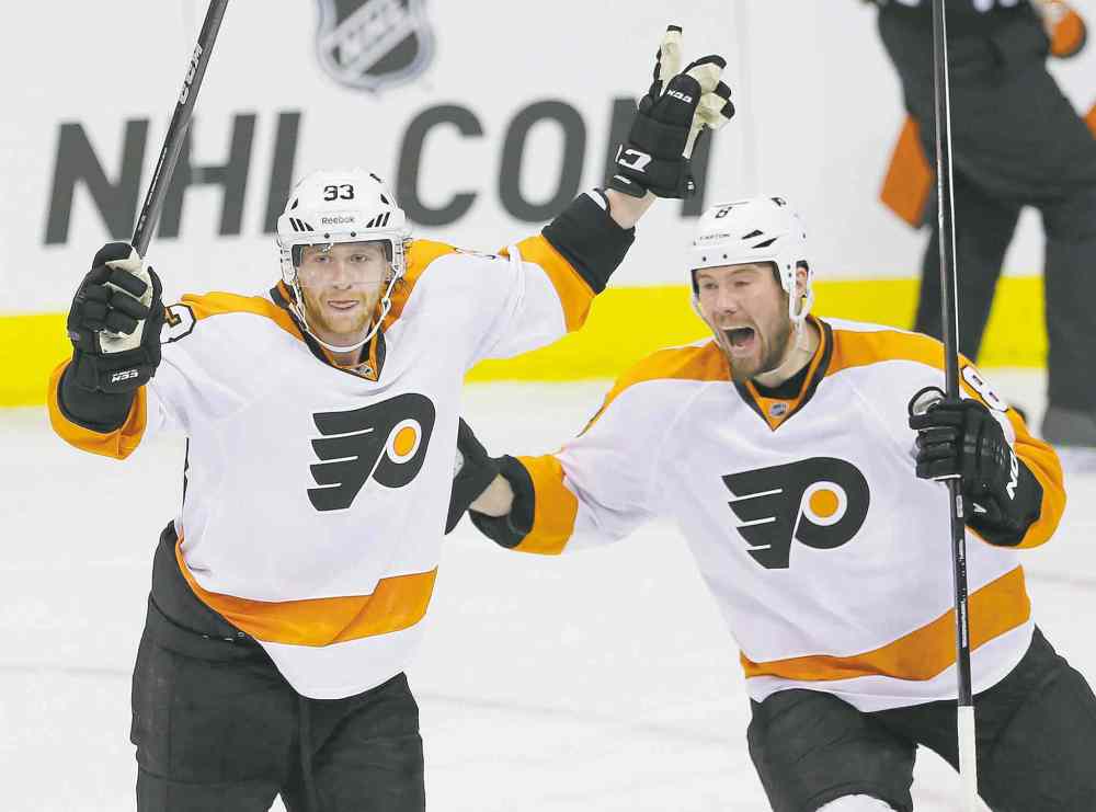 WINNIPEG FREE PRESS
photos by John Woods / WINNIPEG FREE PRESS
The Philadelphia Flyers� Jakub Voracek (left) and Nicklas Grossmann celebrate Voracek�s game-winning goal 10 seconds into overtime.