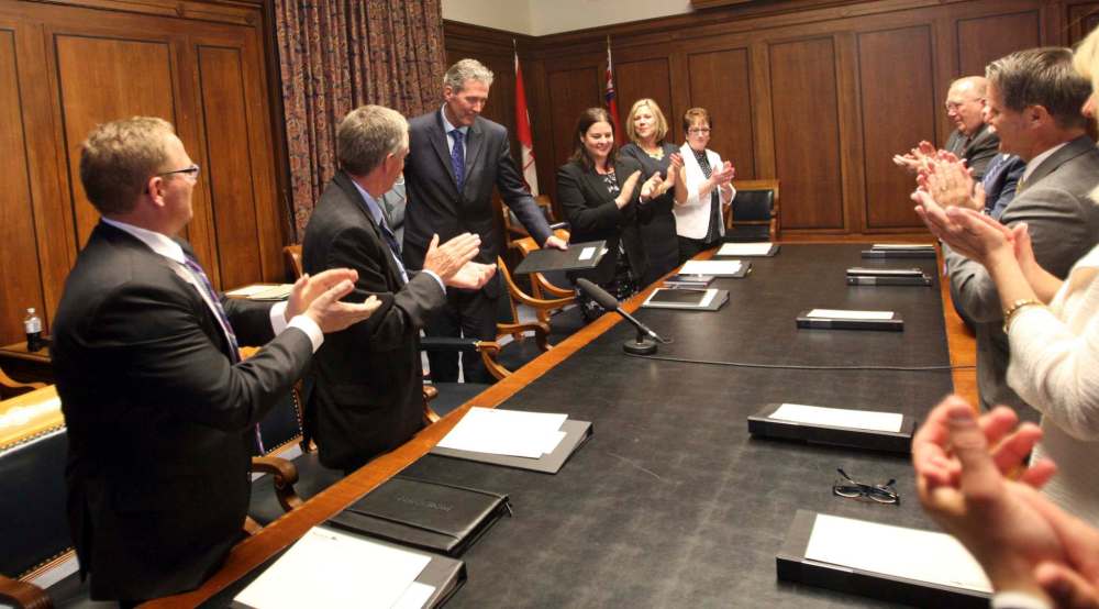 WAYNE GLOWACKI / WINNIPEG FREE PRESS
Manitoba Progressive Conservative cabinet ministers welcome Premier Brian Pallister to their first meeting in the legislative building Tuesday.
