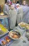 THE ASSOCIATED PRESS files
Heart surgeons prepare a patient for  a transplant.