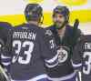 Trevor Hagan / The Canadian Press
Winnipeg's Dustin Byfuglien and Mathieu Perreault (85) celebrate after their club whipped Florida Tuesday night.