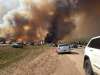 HANDOUT / THE CANADIAN PRESS
Abandoned vehicles litter Highway 63, south of Fort McMurray, Alta., as residents fled the wildfire engulfing the city on Tuesday.