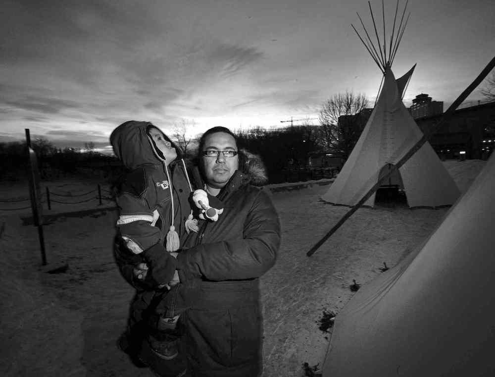 Phil Hossack / Winnipeg Free Press
Willis Petti, with his son, Cassius, says he isn't surprised the city was called the most racist in Canada. He's experienced it first-hand.