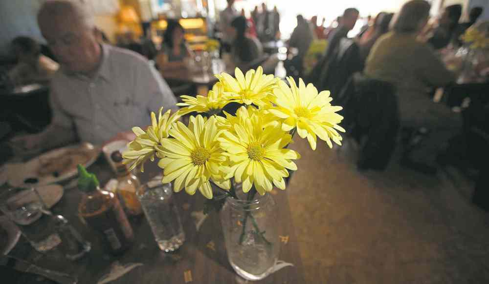 Flowers adorn every table.