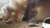 Brian Langton / The Canadian Press
Abandoned vehicles litter Highway 63, south of Fort McMurray, Alta., as residents flee the wildfire engulfing the oilsands city.