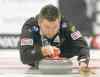 Tim Smith / Brandon Sun
Mike McEwen throws a rock during the Safeway Championship provincial men's curling at Westman Place on Friday evening.