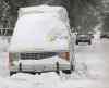 Wayne Glowacki / Winnipeg Free Press files 
Don't let this be you on Friday: A snow-packed vehicle on Amherst Street is ticketed during a residential parking ban in 2013.