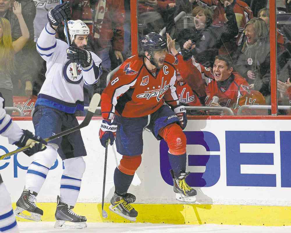 The Associated Press
Nick Wass / the associated press
Capitals captain Alex Ovechkin (right) reacts after scoring his 38th goal of the season in the first period Thursday night.
