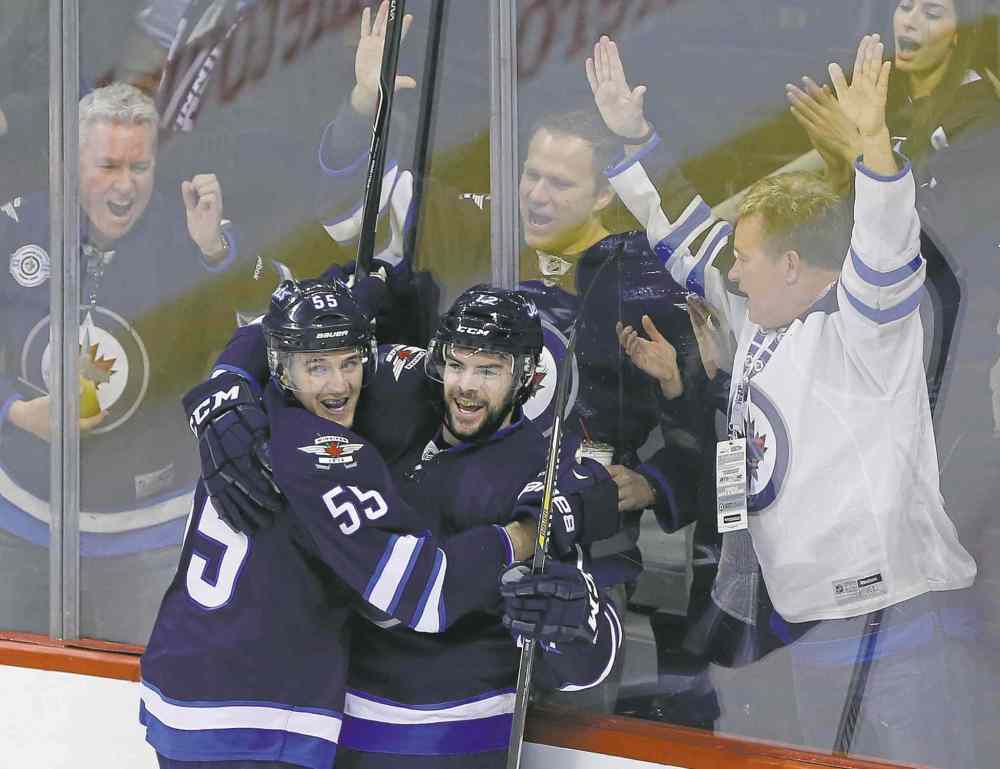 WINNIPEG FREE PRESS
john woods / winnipeg free press
Winnipeg Jets Mark Scheifele (55) and Drew Stafford, and some hometown fans, celebrate Stafford�s first-period goal against the Los Angeles Kings Sunday afternoon.
