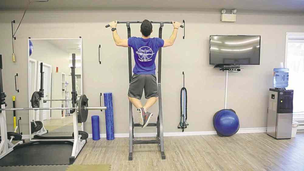Tim Shantz demonstrates the chin-up.