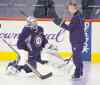 BORIS MINKEVICH / WINNIPEG FREE PRESS
Ondrej Pavelec and goaltending coach Wade Flaherty made time for a strategy session at Wednesday's practice.